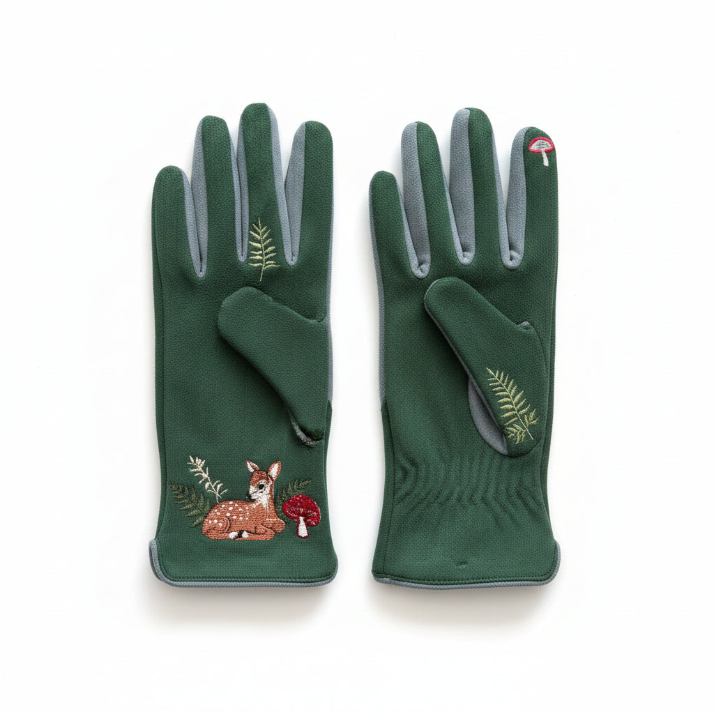 Deer gloves flat lay showing front and back on pink background with ferns