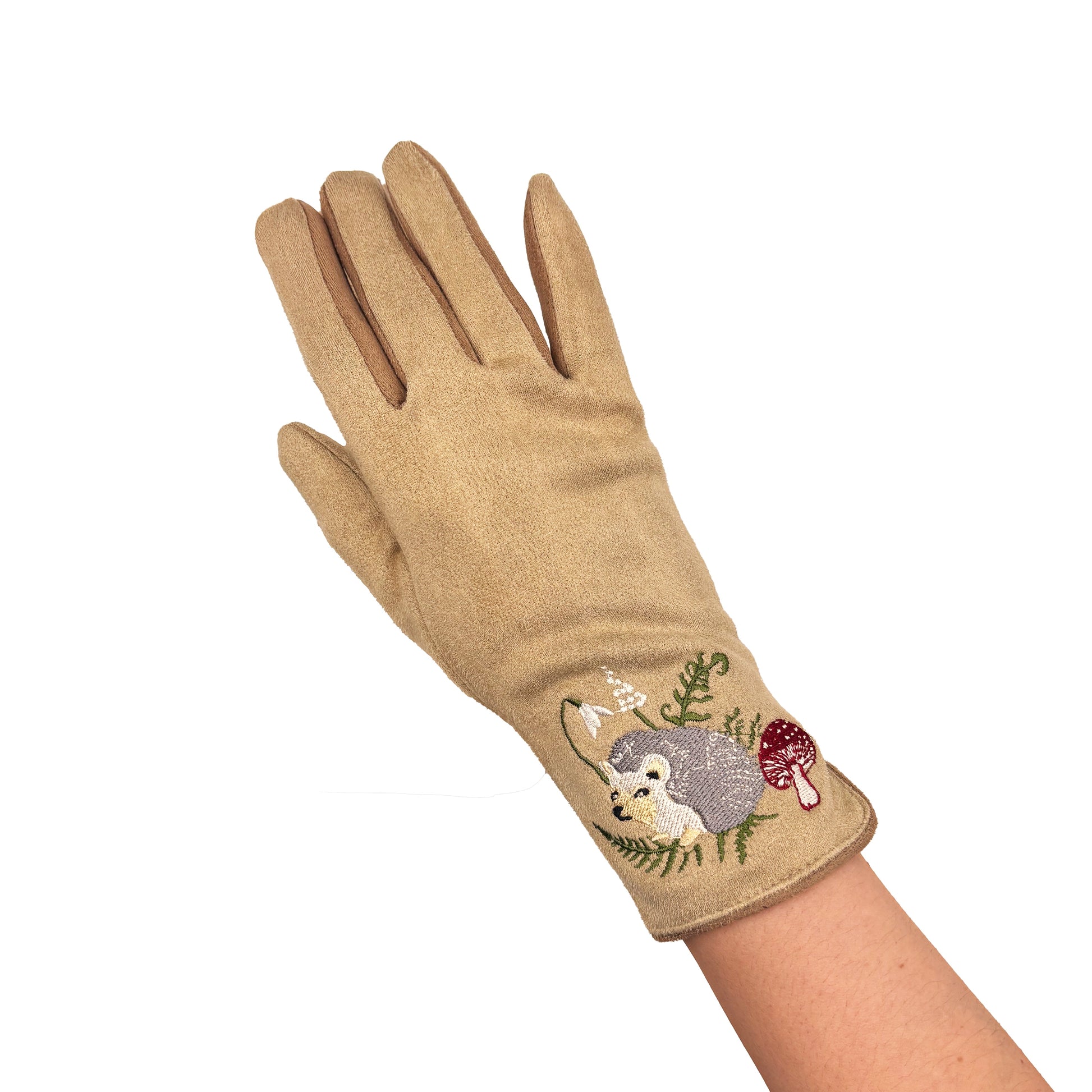 Embroidered hedgehog glove worn on hand against white background
