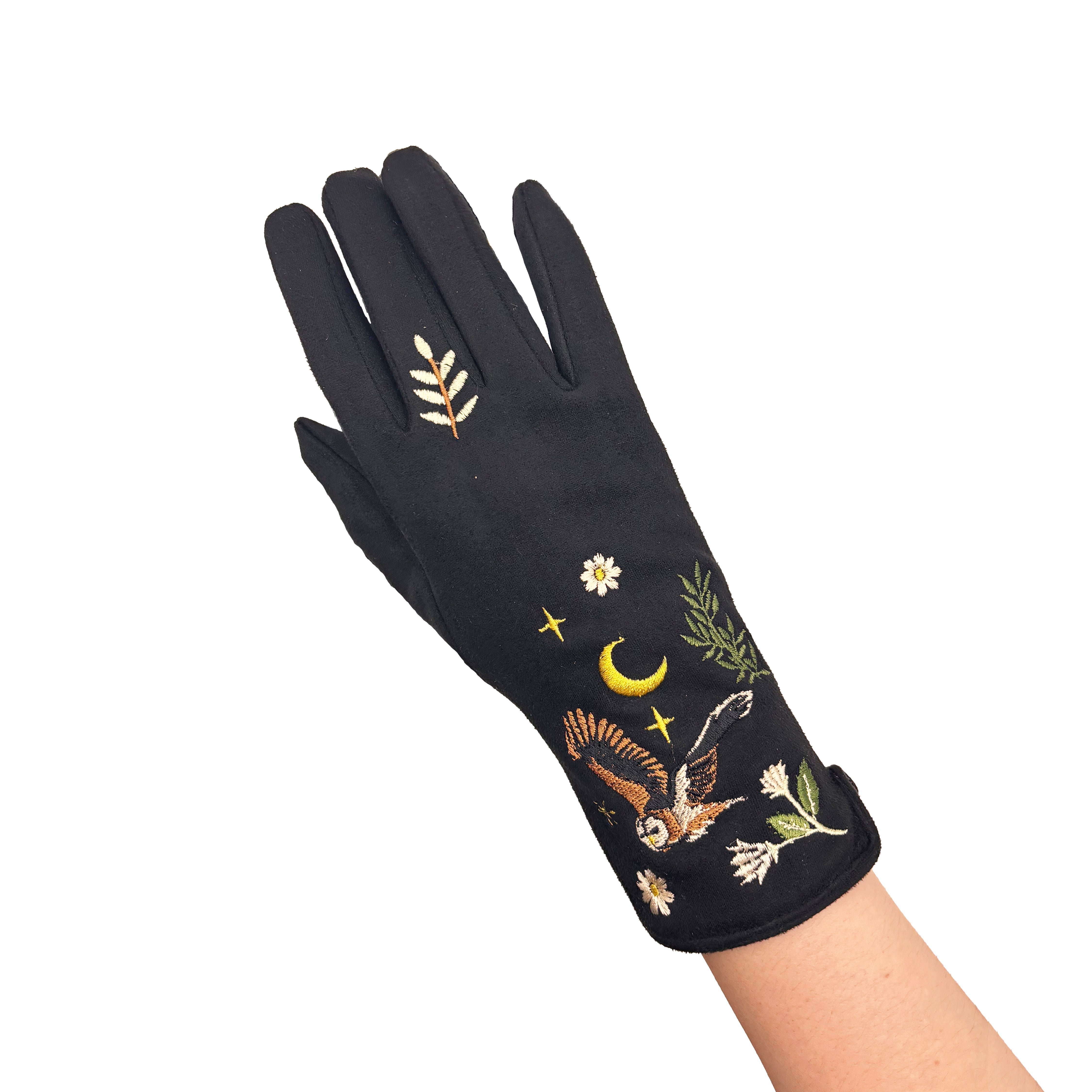 Single black owl glove worn on hand showing embroidery on white background