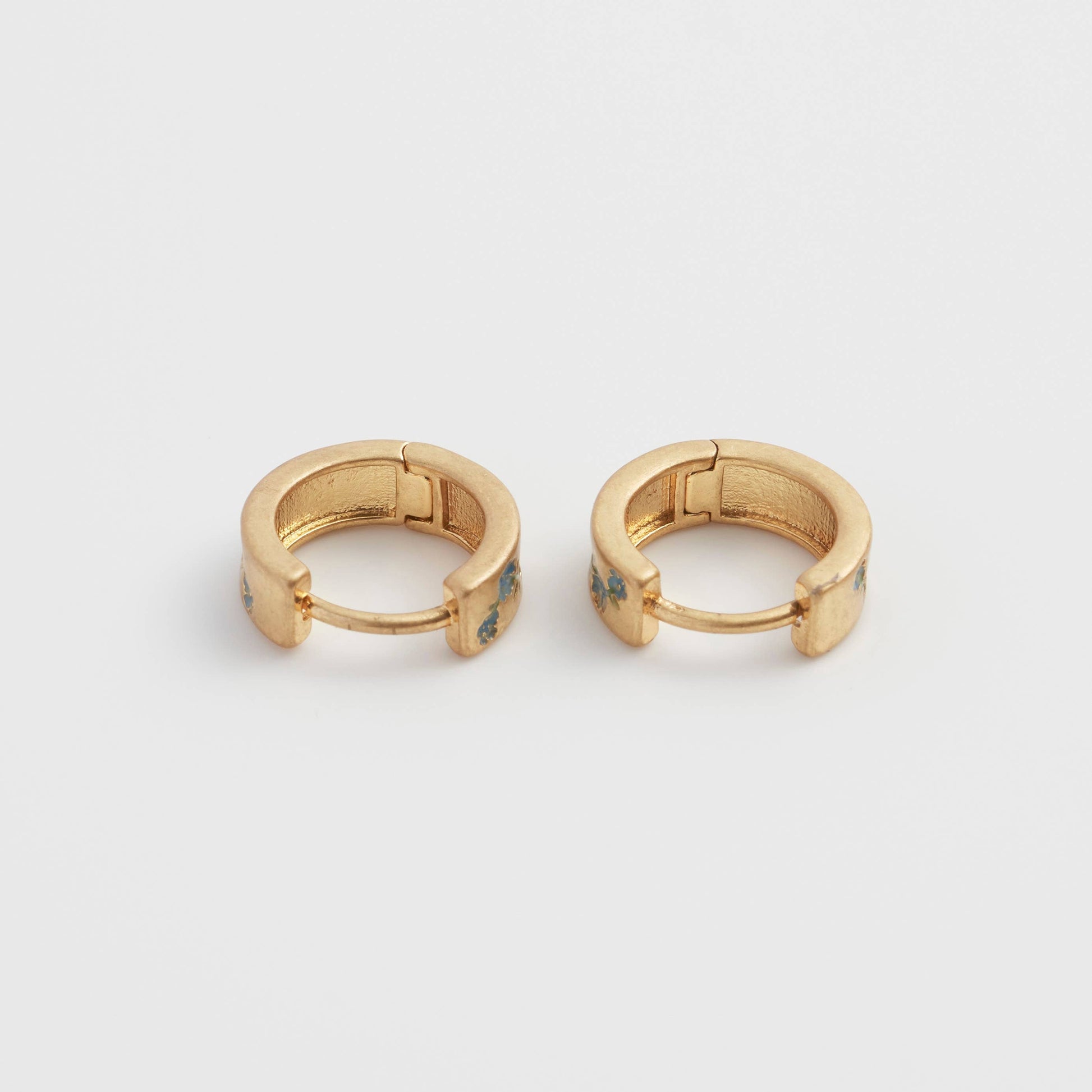Forget-me-not hoop earrings pair, hinge open, symmetrical front view