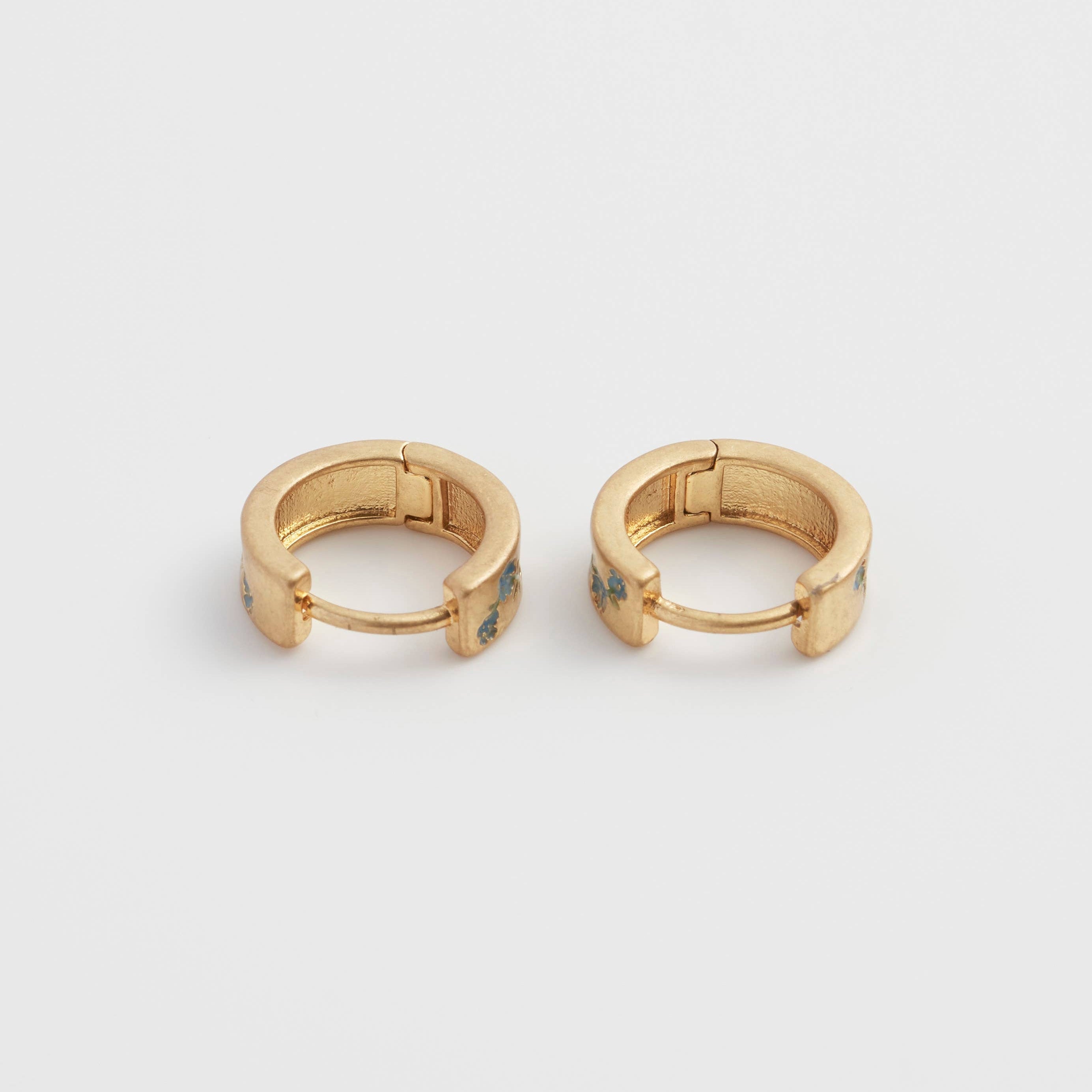 Forget-me-not hoop earrings pair, hinge open, symmetrical front view