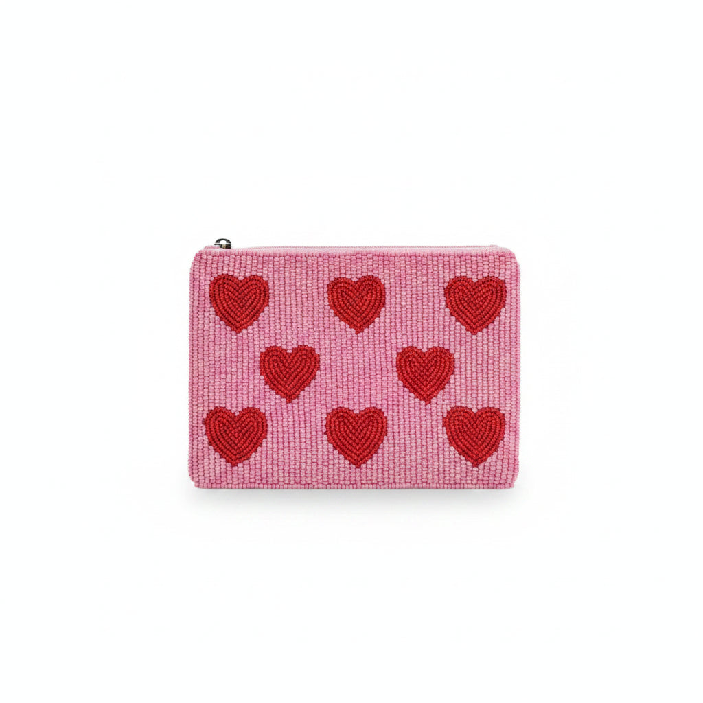 Hearts beaded purse held in hand showing heart pattern detail