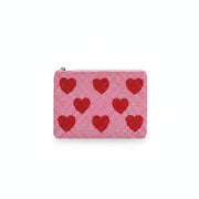 Hearts beaded purse held in hand showing heart pattern detail