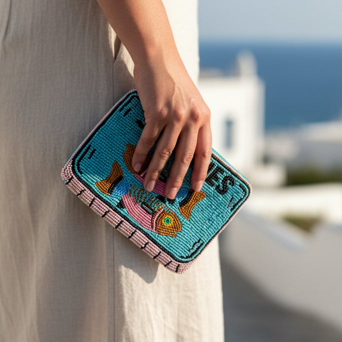 Sardine beaded purse held in hand showing size and detail