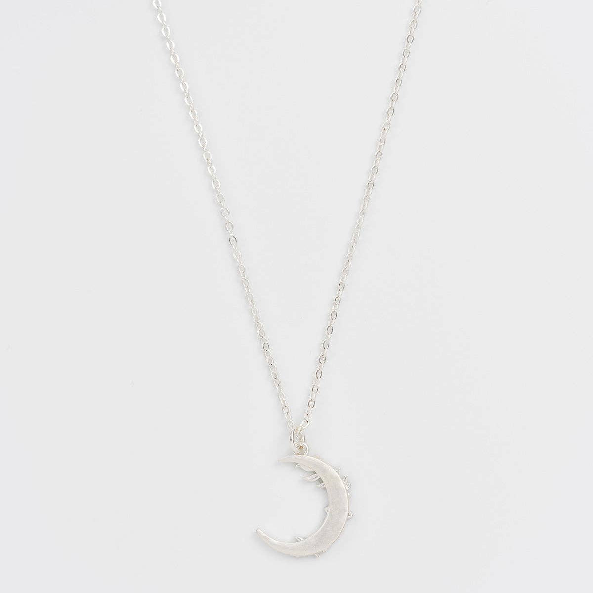 Reverse side of the silver crescent moon pendant, plain finish