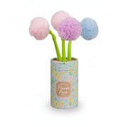 Three pom pom flower pens in pink, purple and blue in a floral pot, white background
