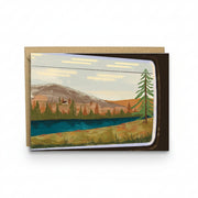 Illustrated greetings card showing a view through a train window.