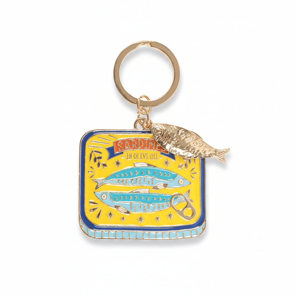 Enamel sardine tin keyring showing colourful fish design angled view