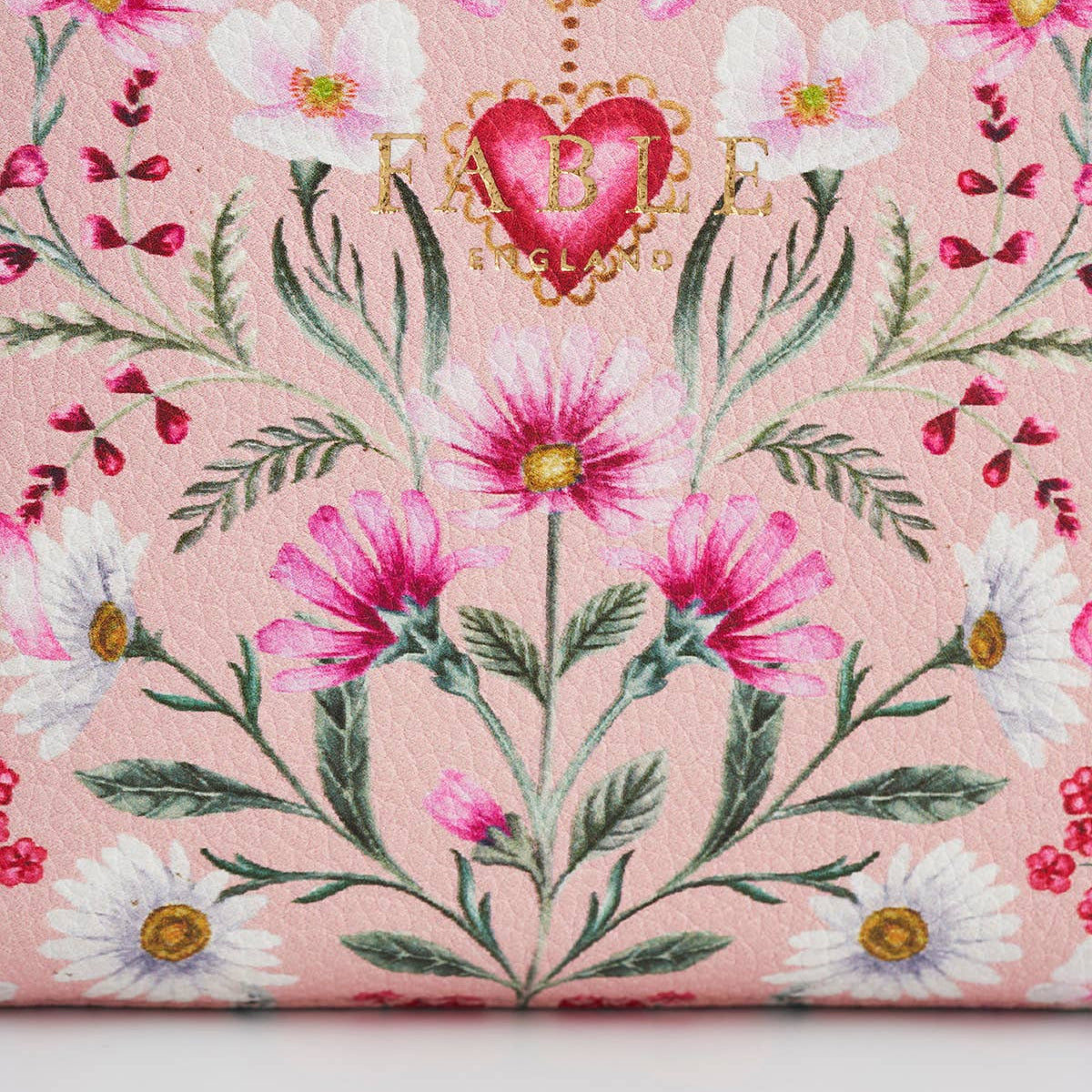 Close up of the Fable England logo and floral print on the purse.