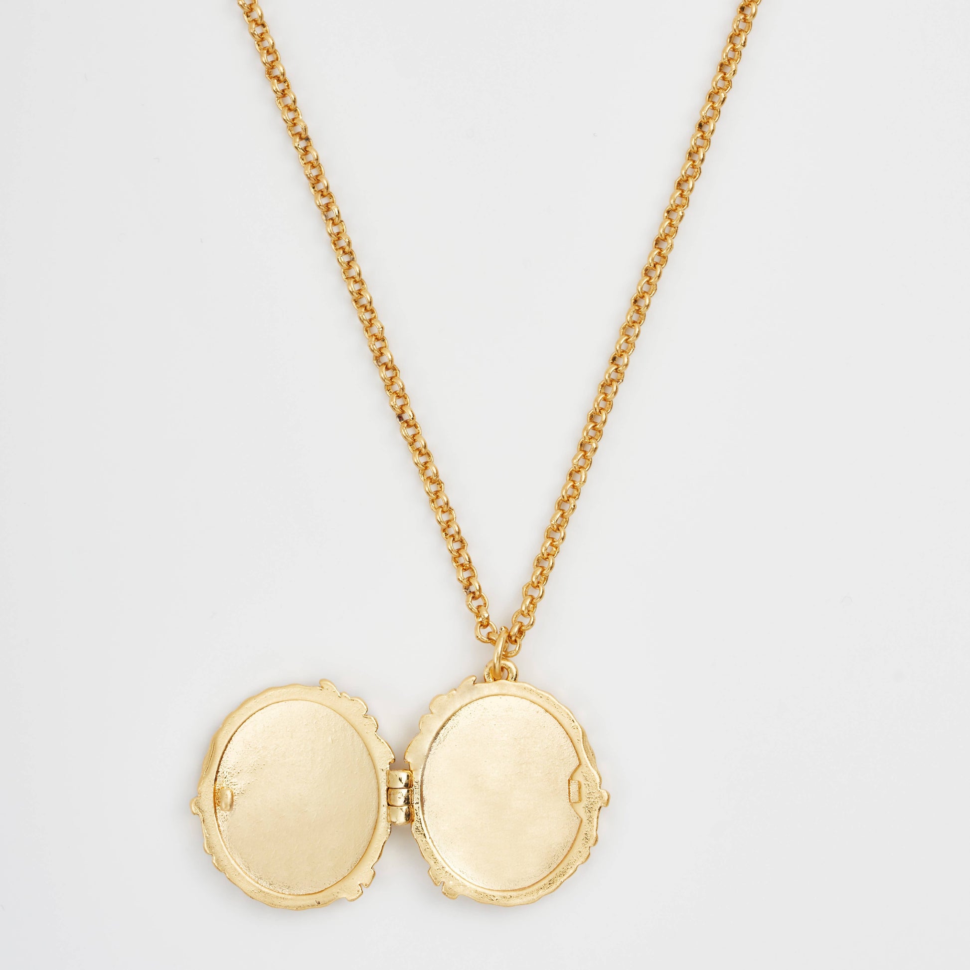 Peter Rabbit cameo locket open showing empty interior compartments on white background