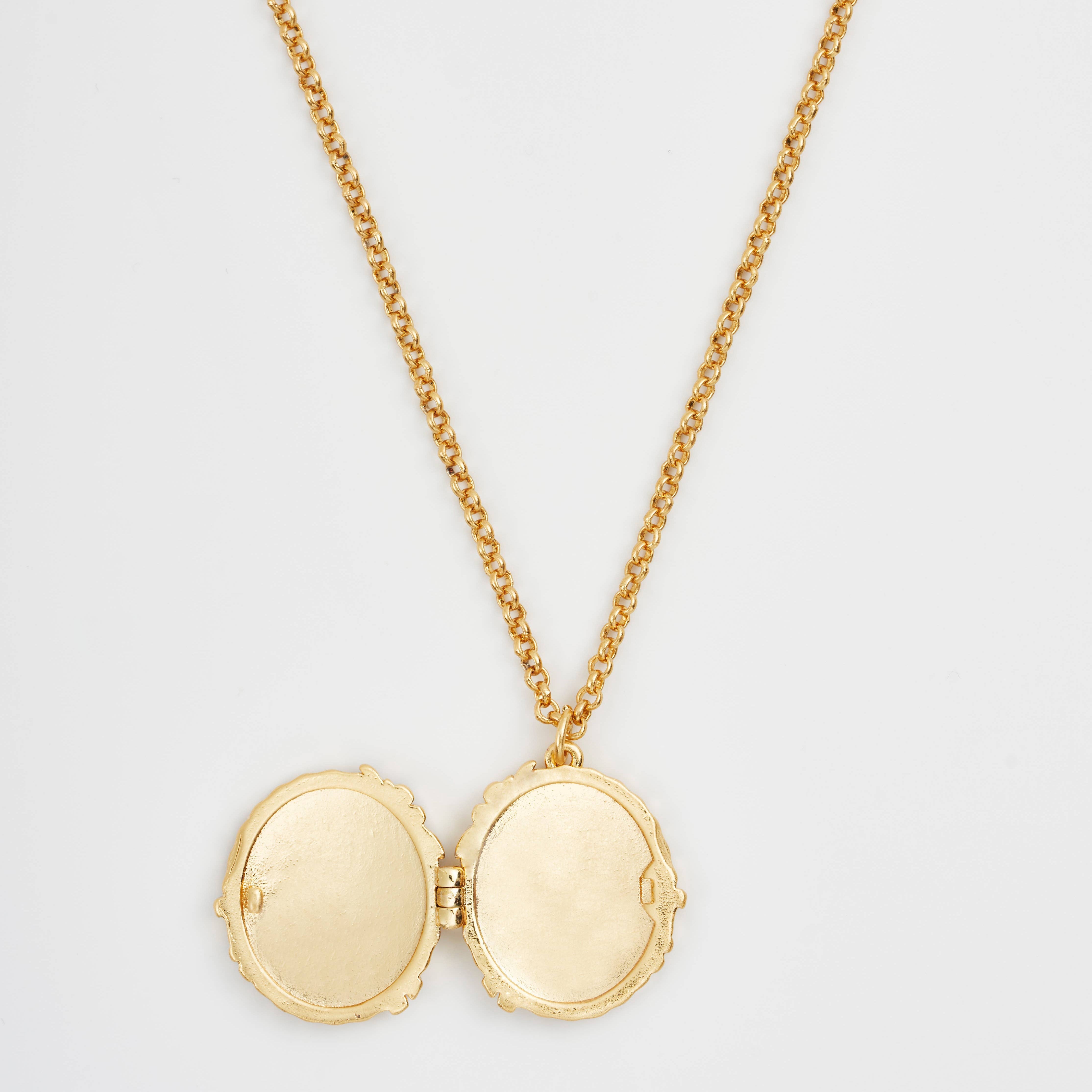 Peter Rabbit cameo locket open showing empty interior compartments on white background