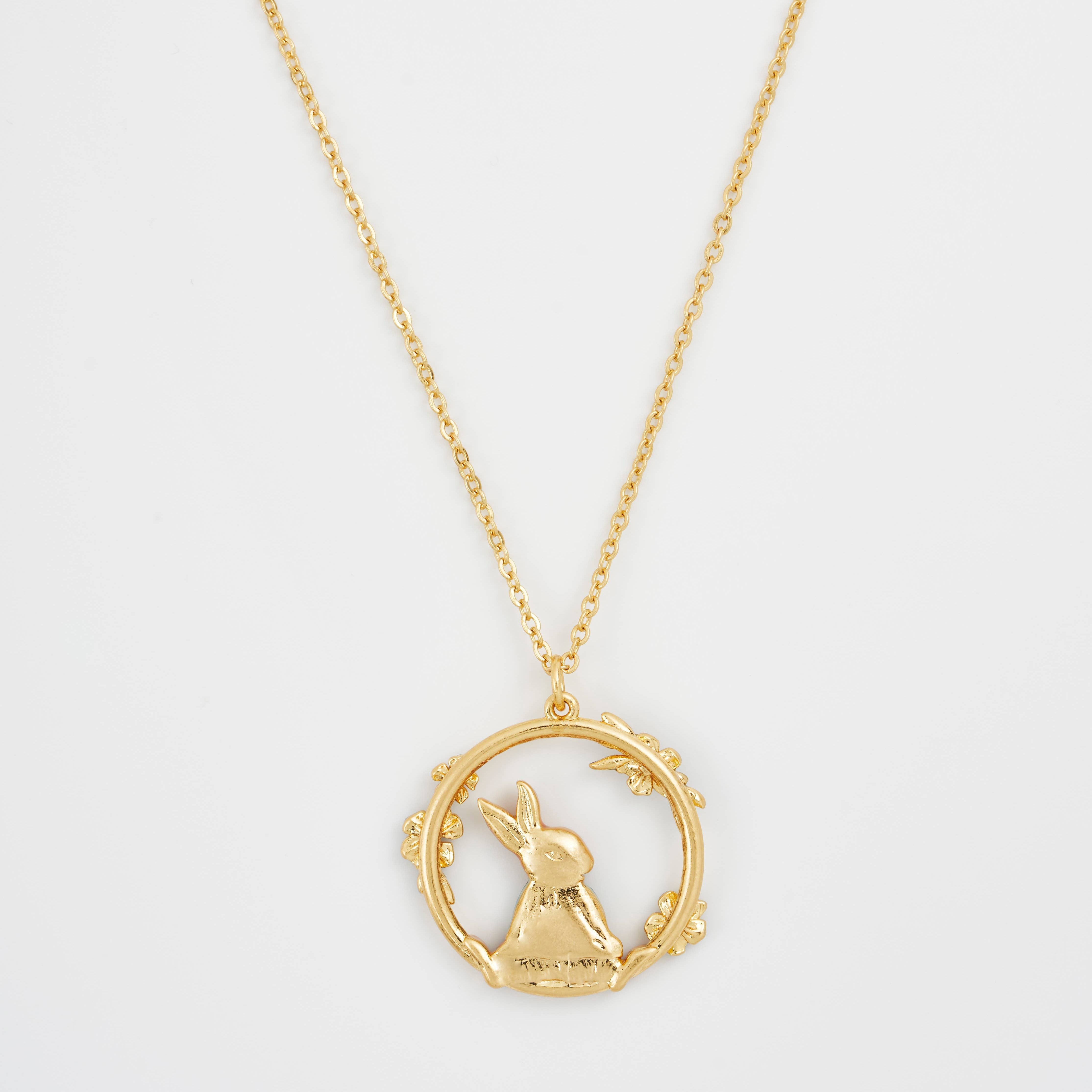 Peter Rabbit forget-me-not pendant reverse showing gold back on white background