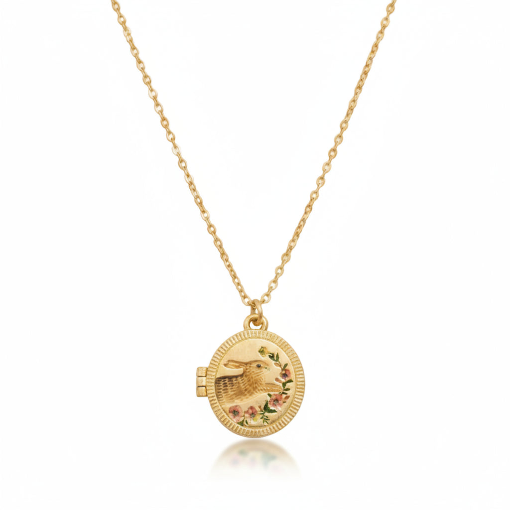 Fable England running bunny locket necklace in gold on white background