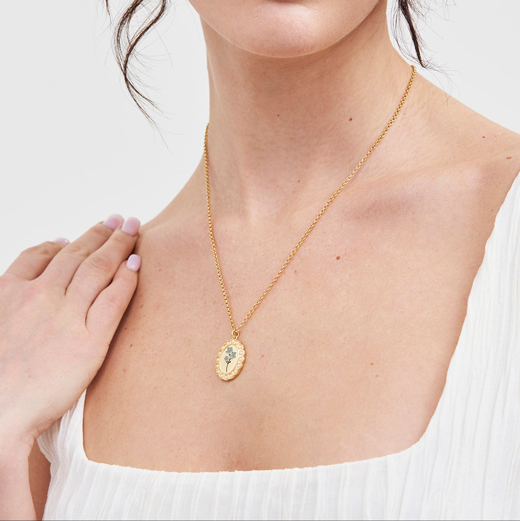Model wearing the Forget Me Not Cameo Necklace