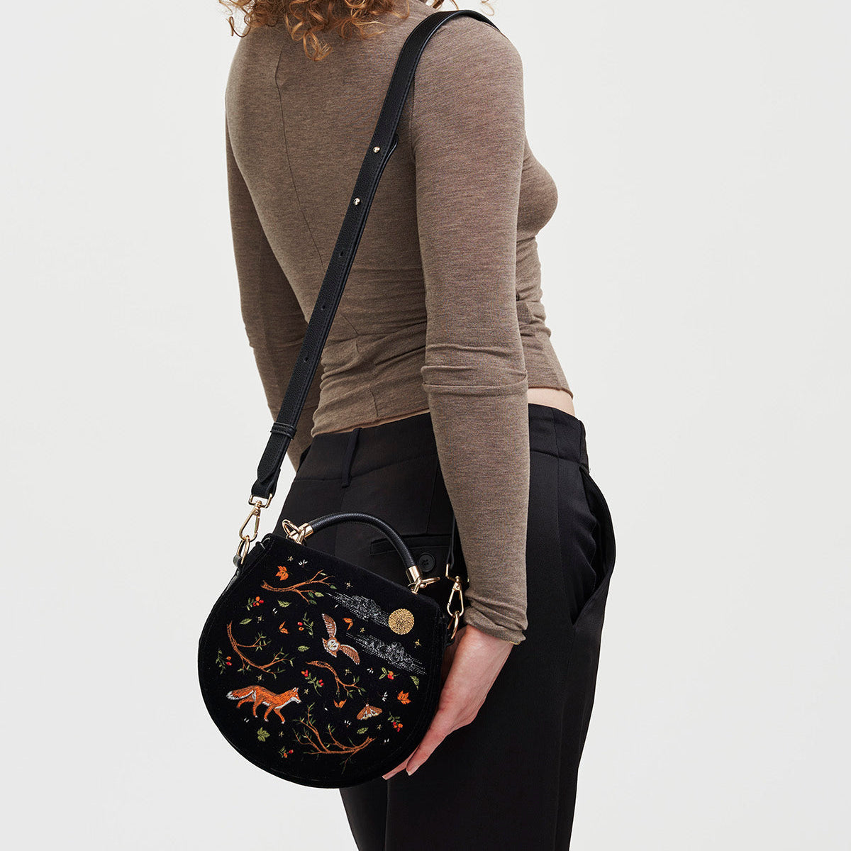 Model wearing the Fox & Owl Embroidered Black Saddle Bag