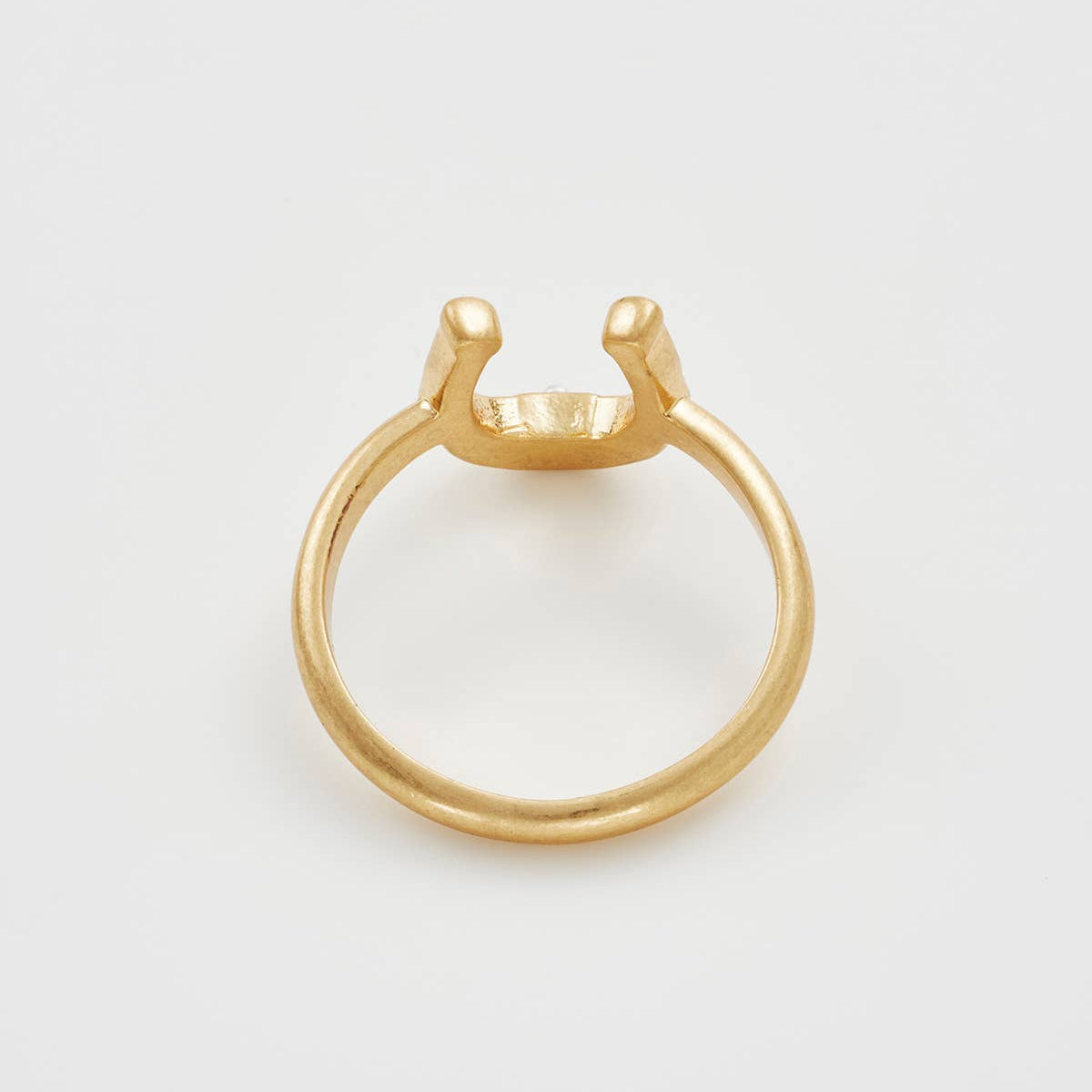 Horseshoe ring back view showing band profile on white background