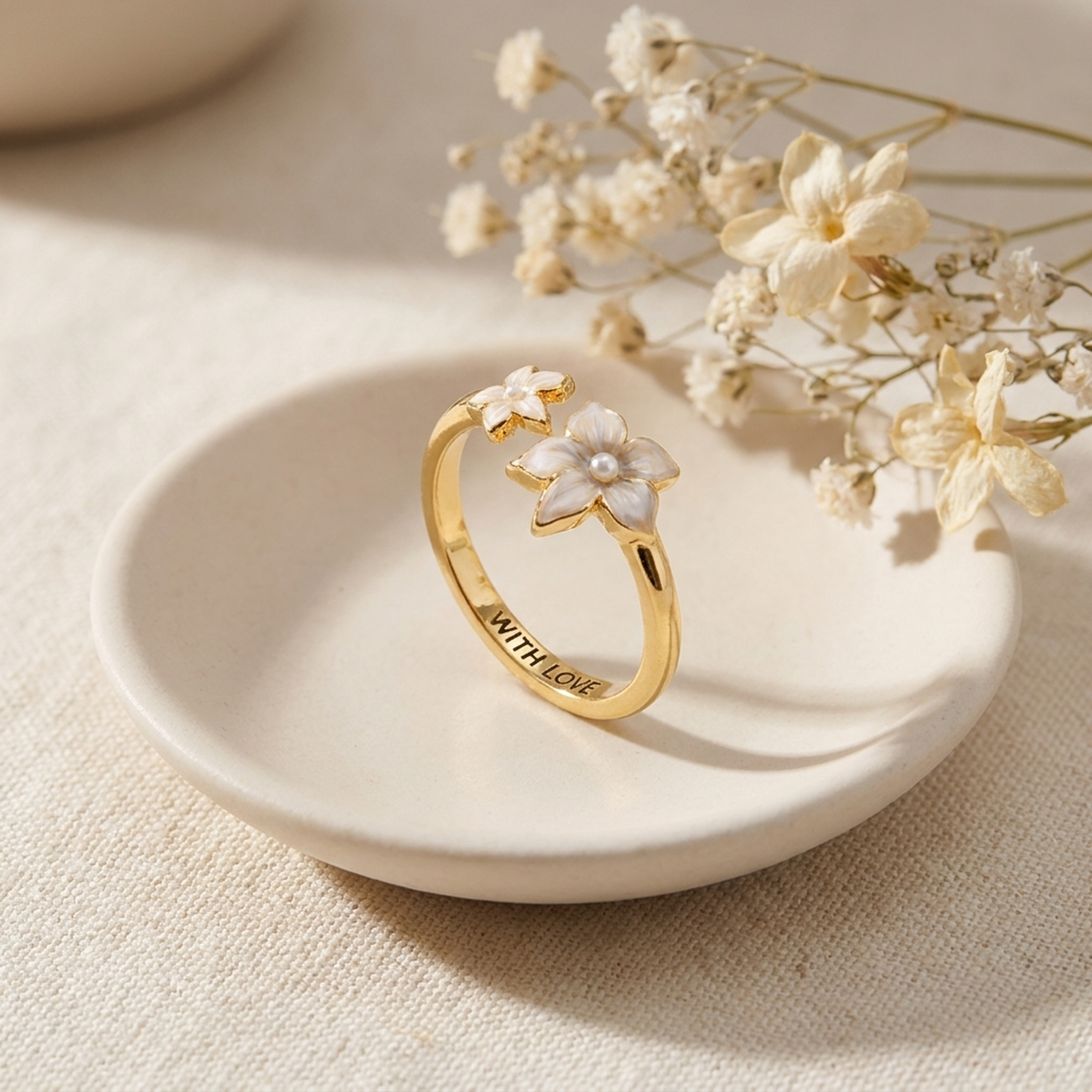 Jasmine Pearl Ring styled on a ceramic dish with cream linen