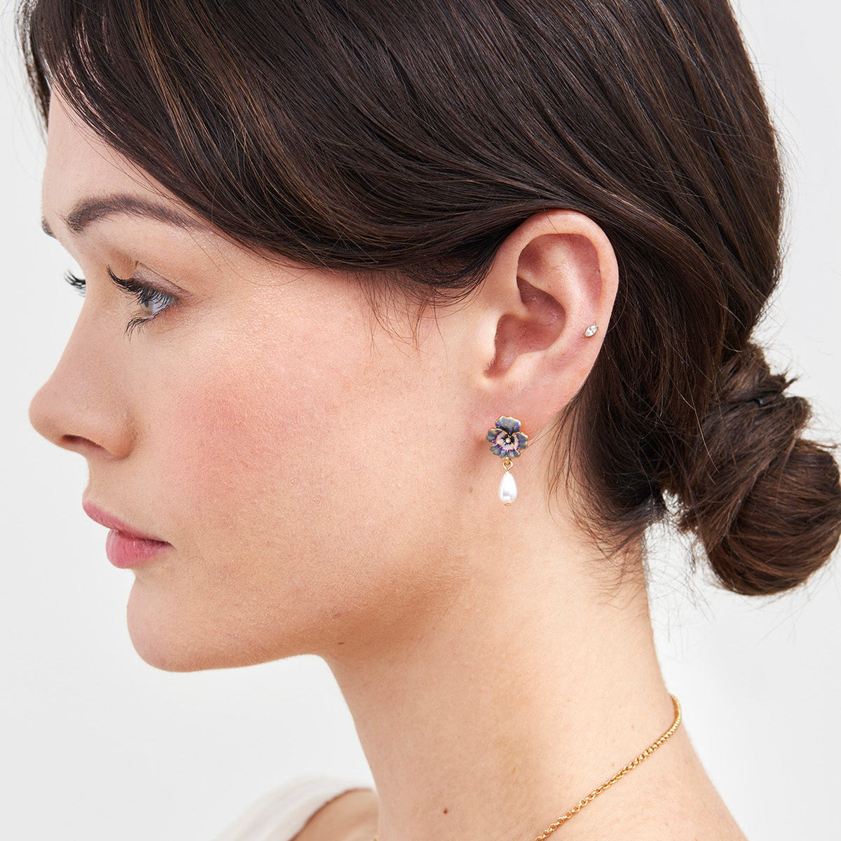 Model wearing the Pansy Pearl Drop Earrings