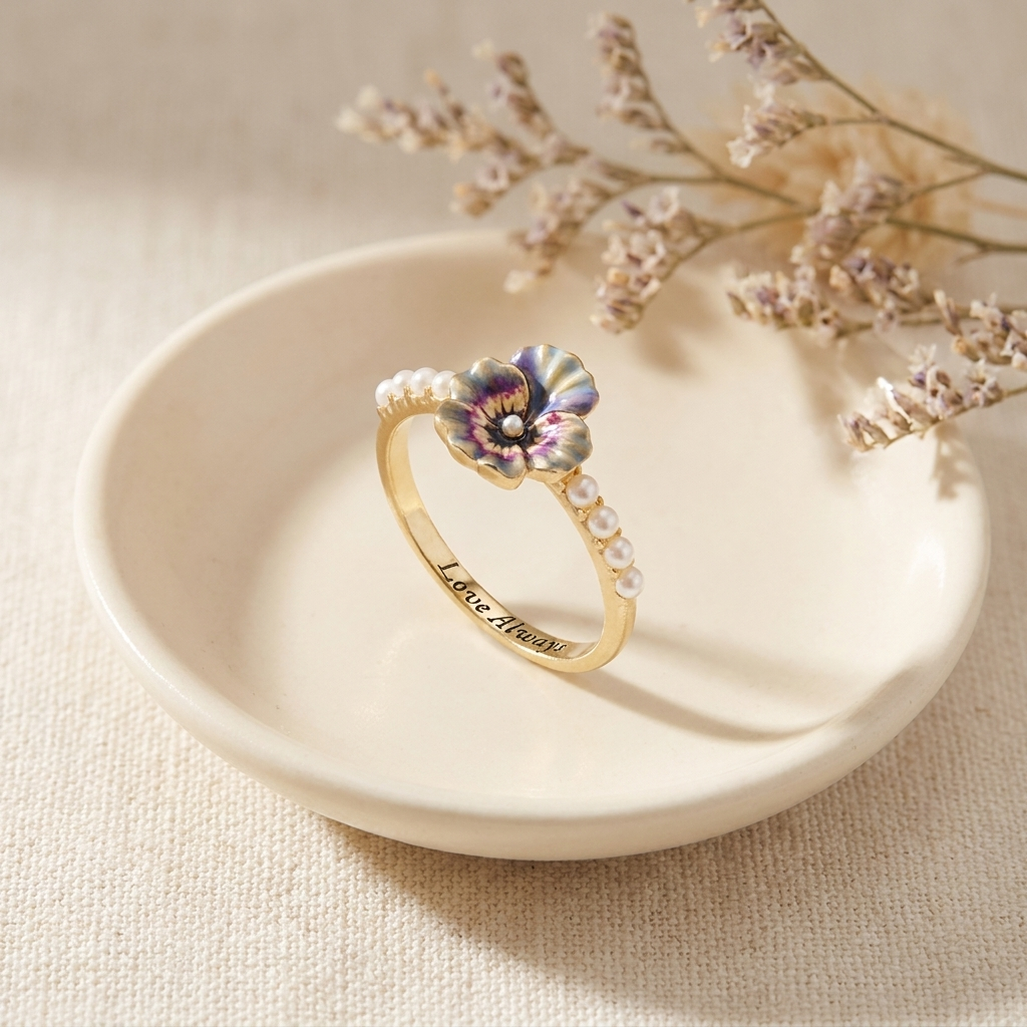 Pansy Pearl Ring styled on a ceramic dish with cream linen
