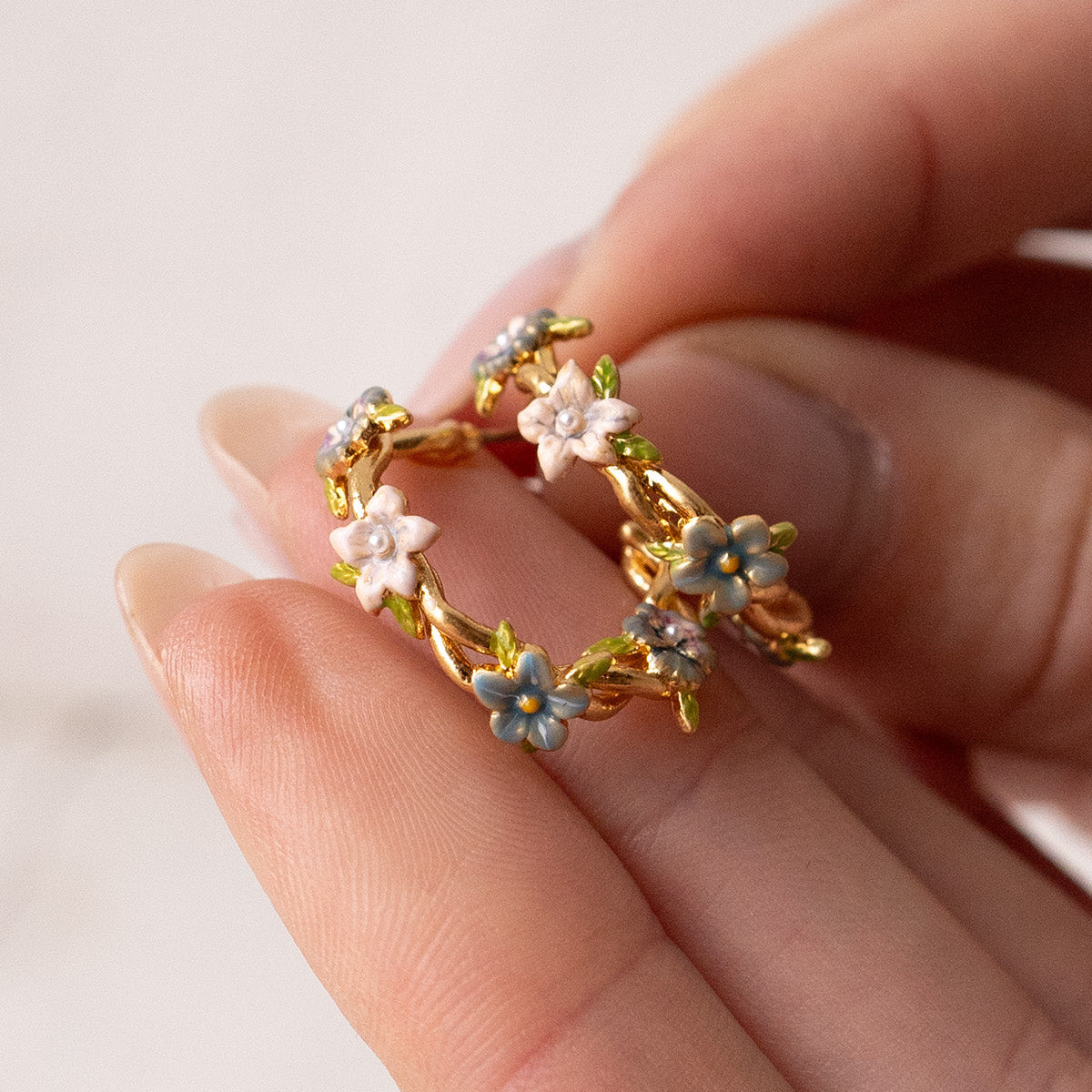 Close-up detail of the Wildflower Garden Hoop Earrings on white