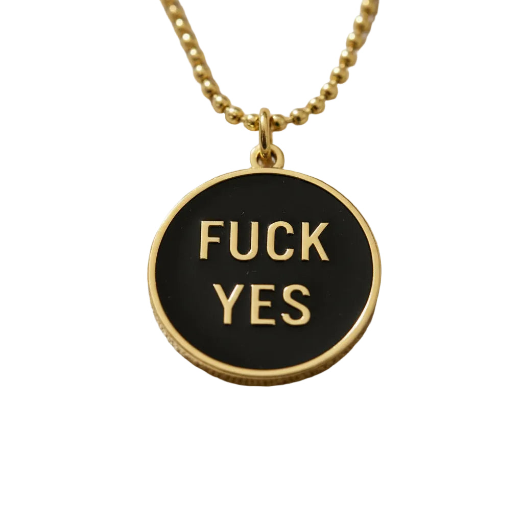 Close up of the black and gold fuck yes necklace.