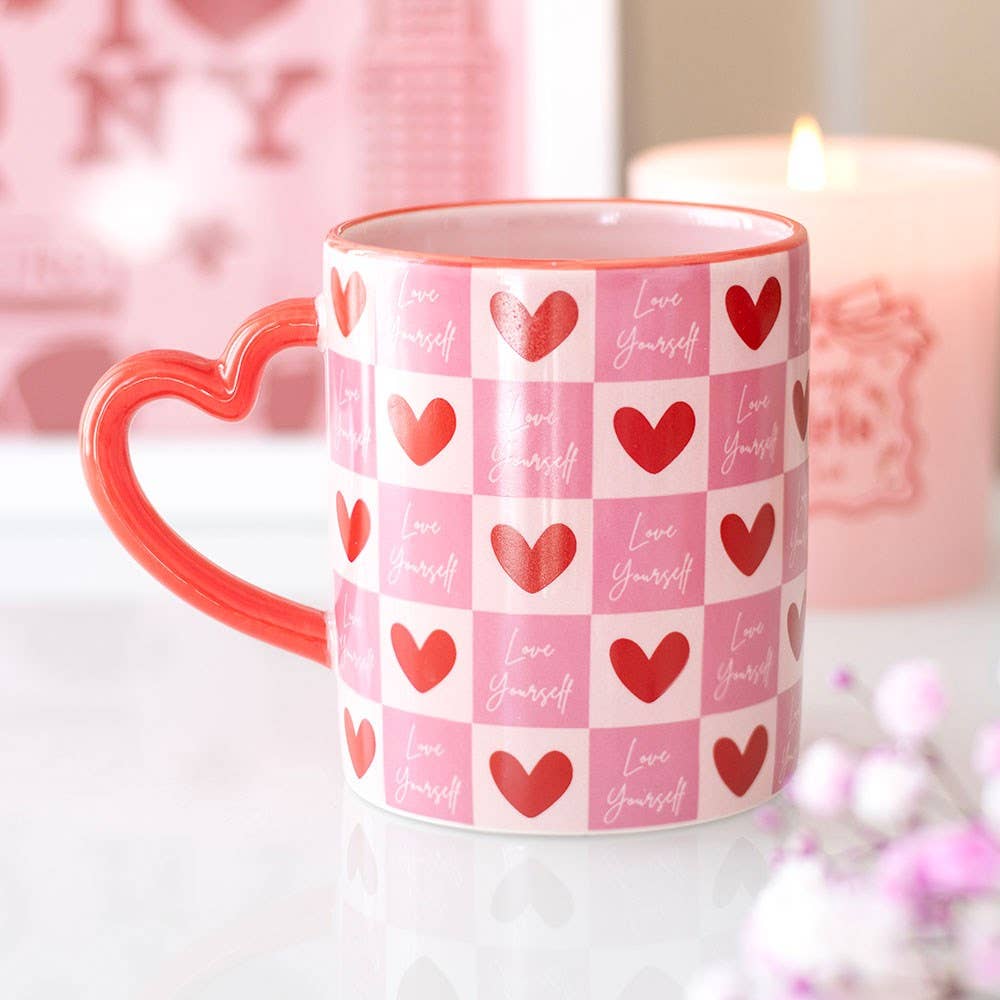Love Yourself heart mug styled with candle in pink setting