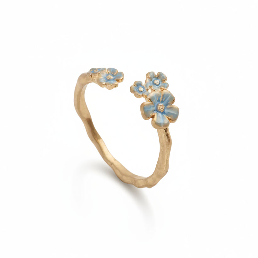 Gold Forget-Me-Not ring with blue enamel flowers on white background