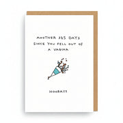 White birthday card with hand-drawn lettering and a small party popper