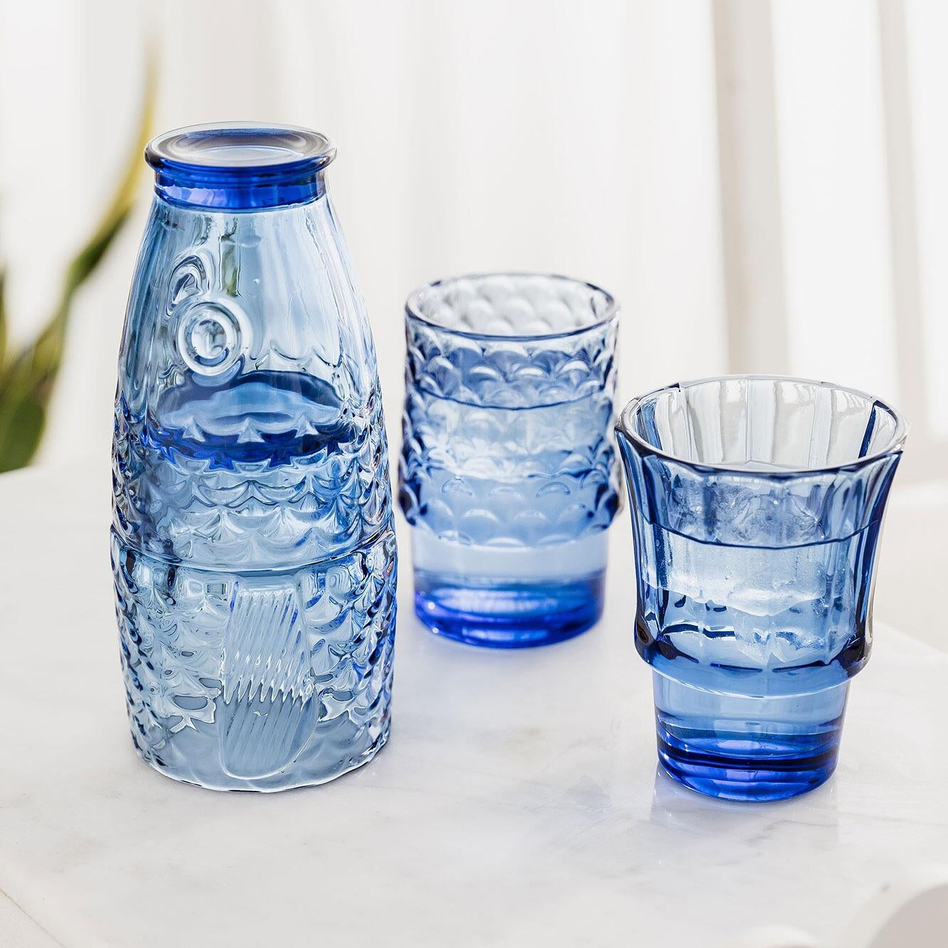 Blue fish stacking glasses, another angle