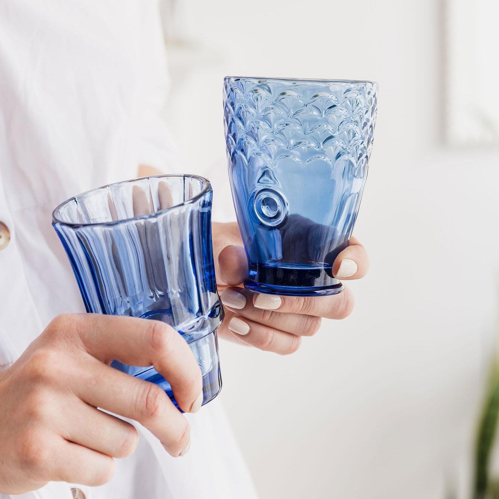 Blue fish stacking glasses assembled into a fish