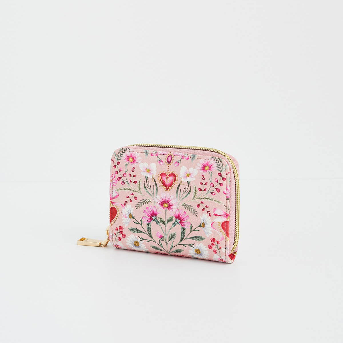 Floral heart pink purse shown at an angle with gold zip.