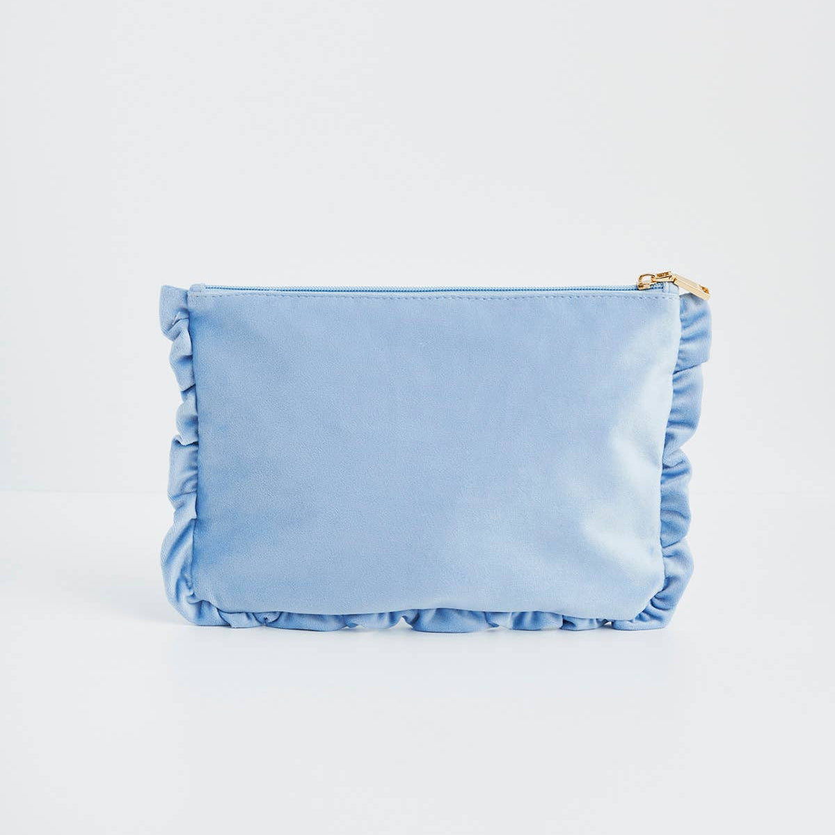 Back view of blue velvet pouch with ruffled edge