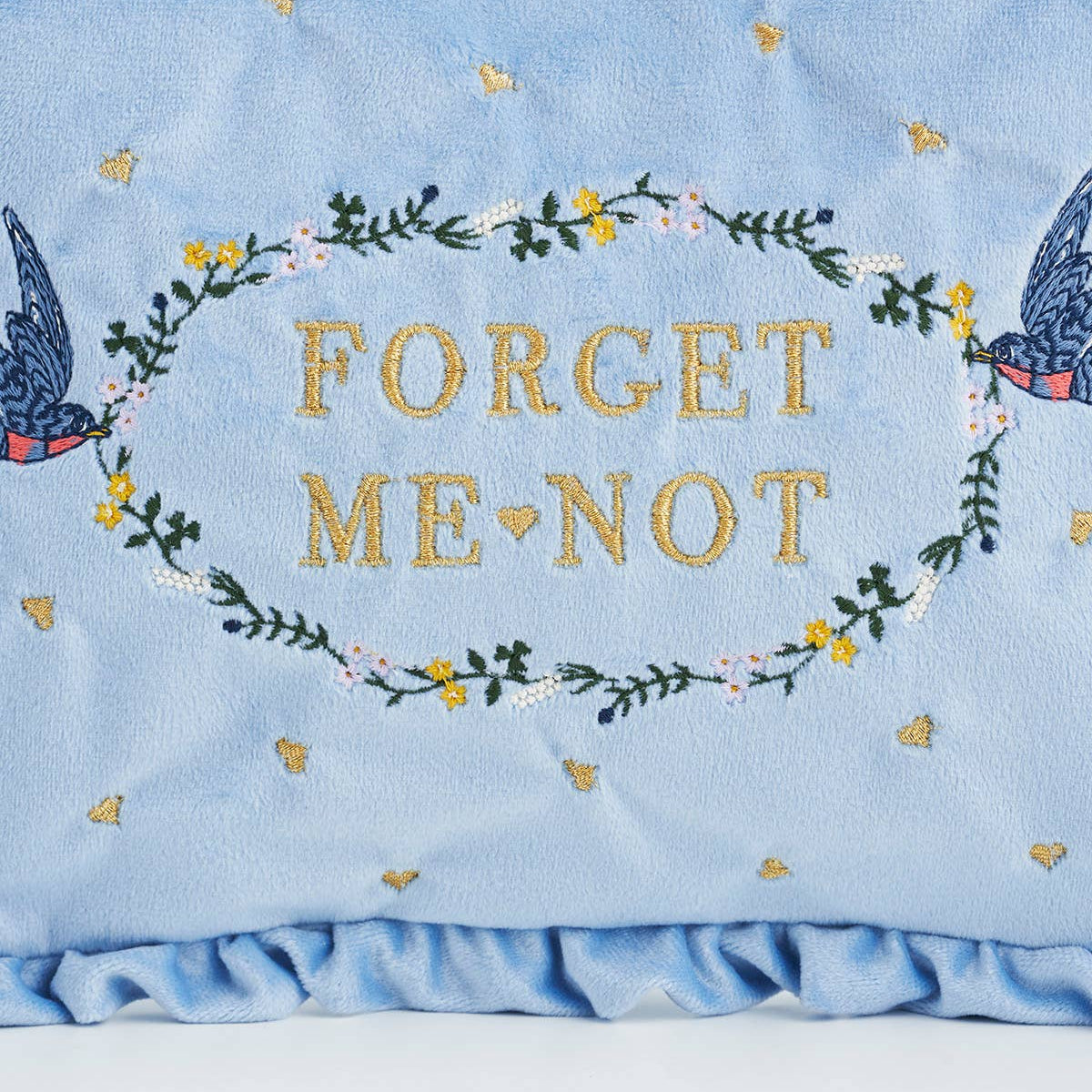 Floral embroidery detail on Forget Me Not velvet pouch