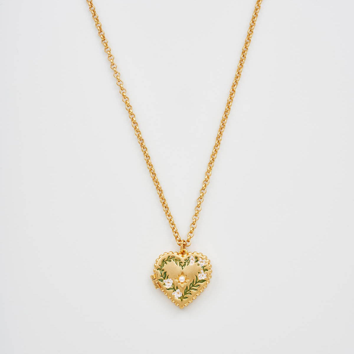 Front view of Gaia Lily Heart Locket Necklace with floral enamel and pearl detail on white background.