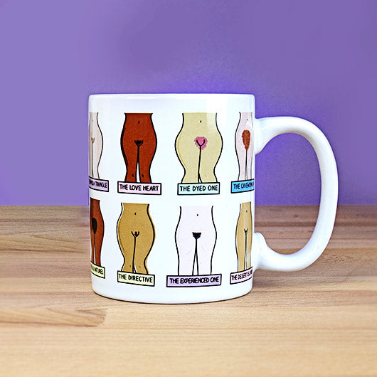 Muff Mug on wooden table against purple background showing cheeky illustrations