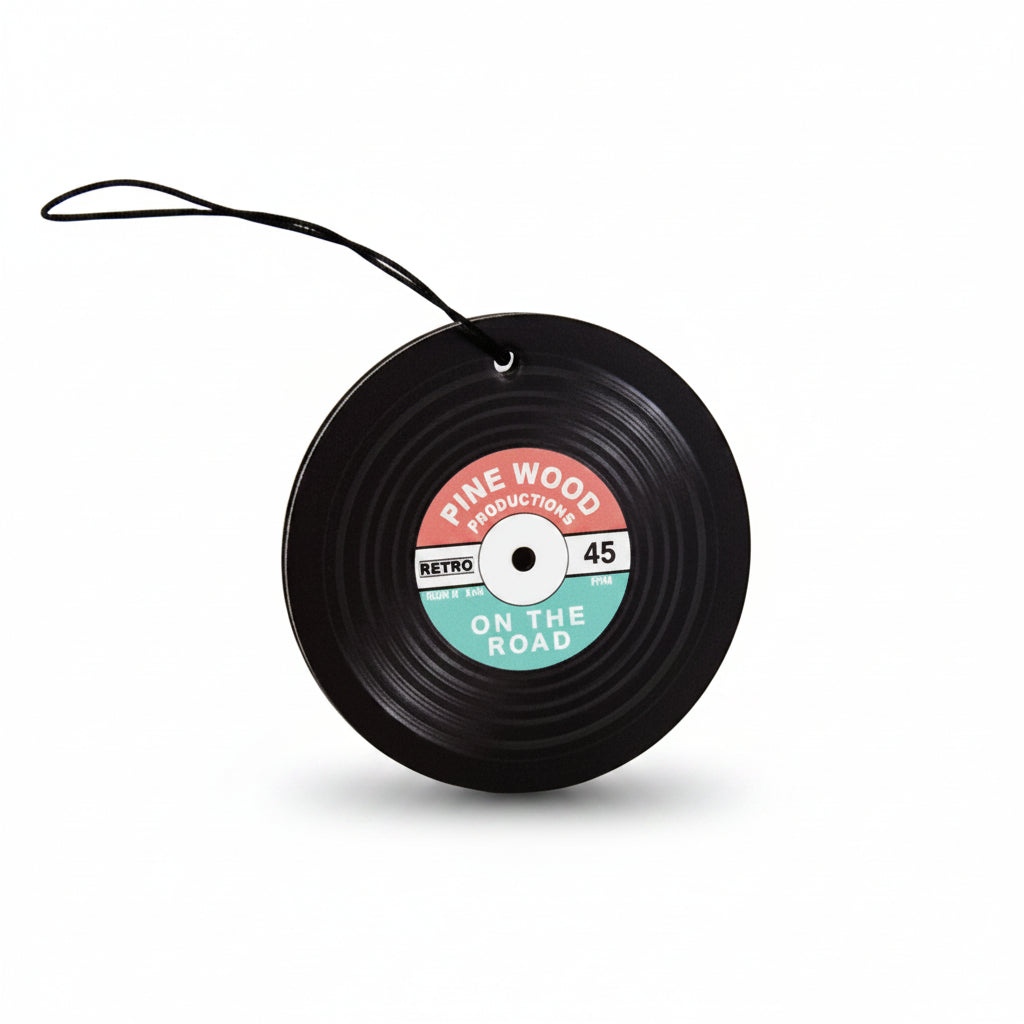 Black vinyl record car air freshener with retro Pine Wood label on white