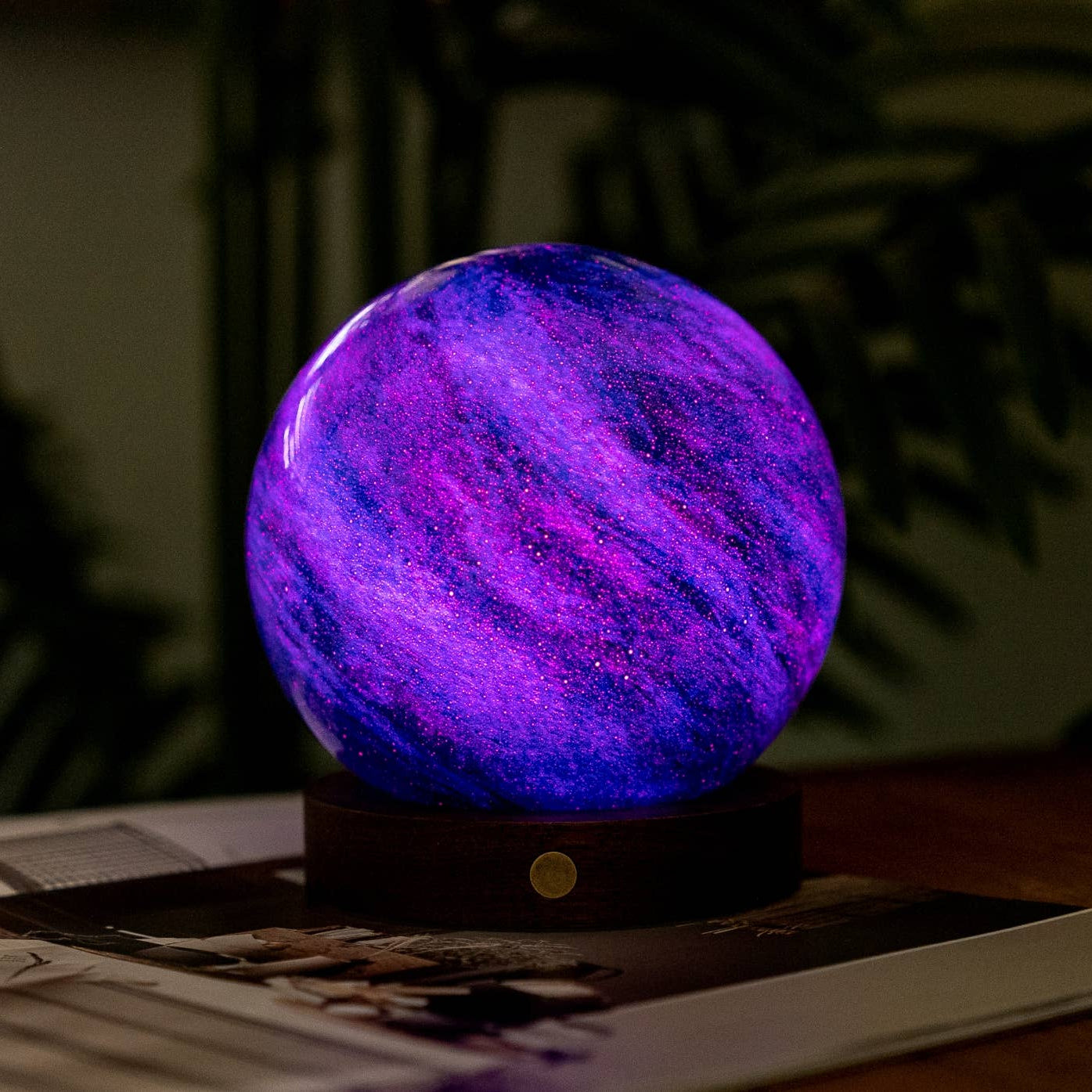 AstraGlass Galaxy Breeze light glowing deep purple on a desk at night