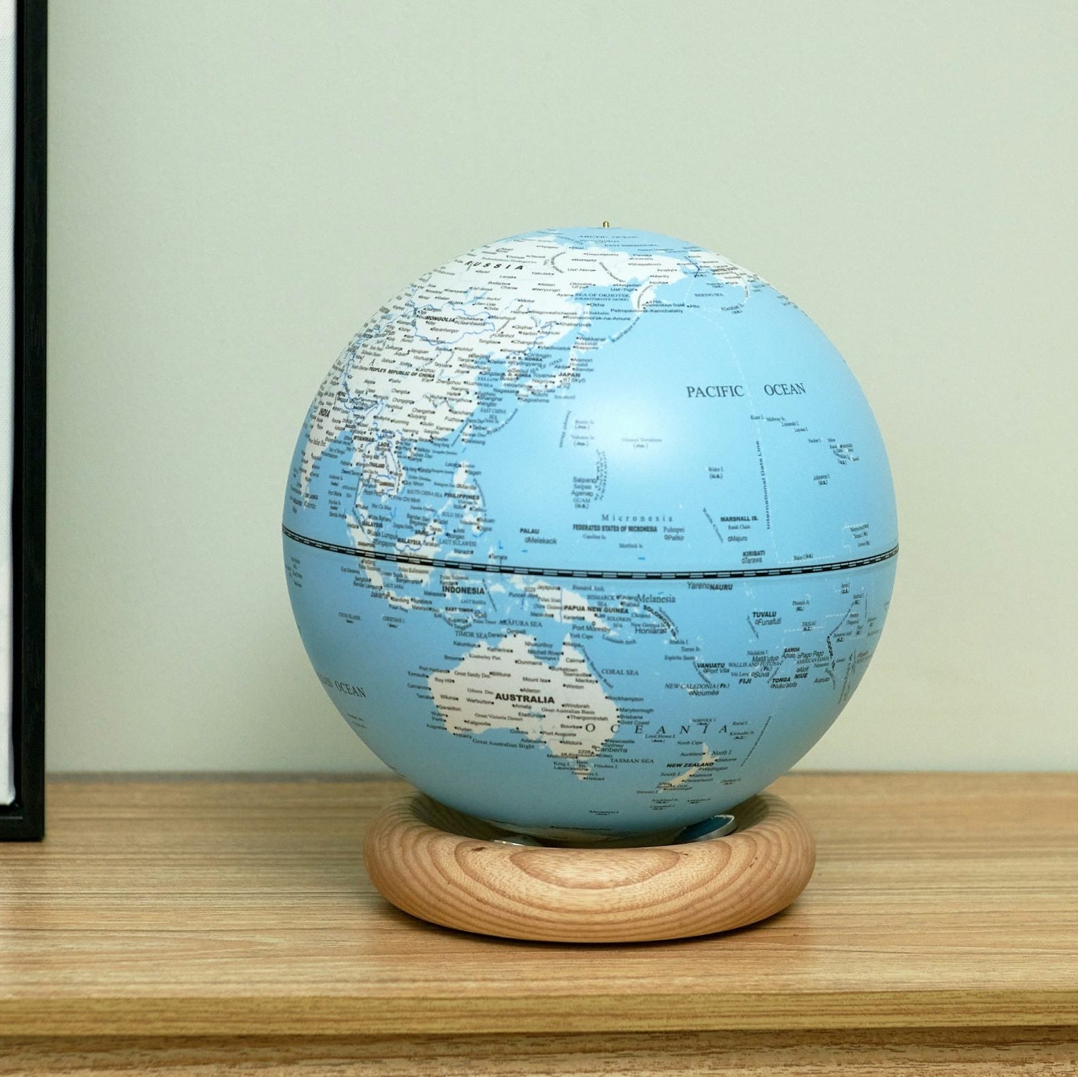 Sky blue AtlasGlobe light turned to show Australia and the Pacific