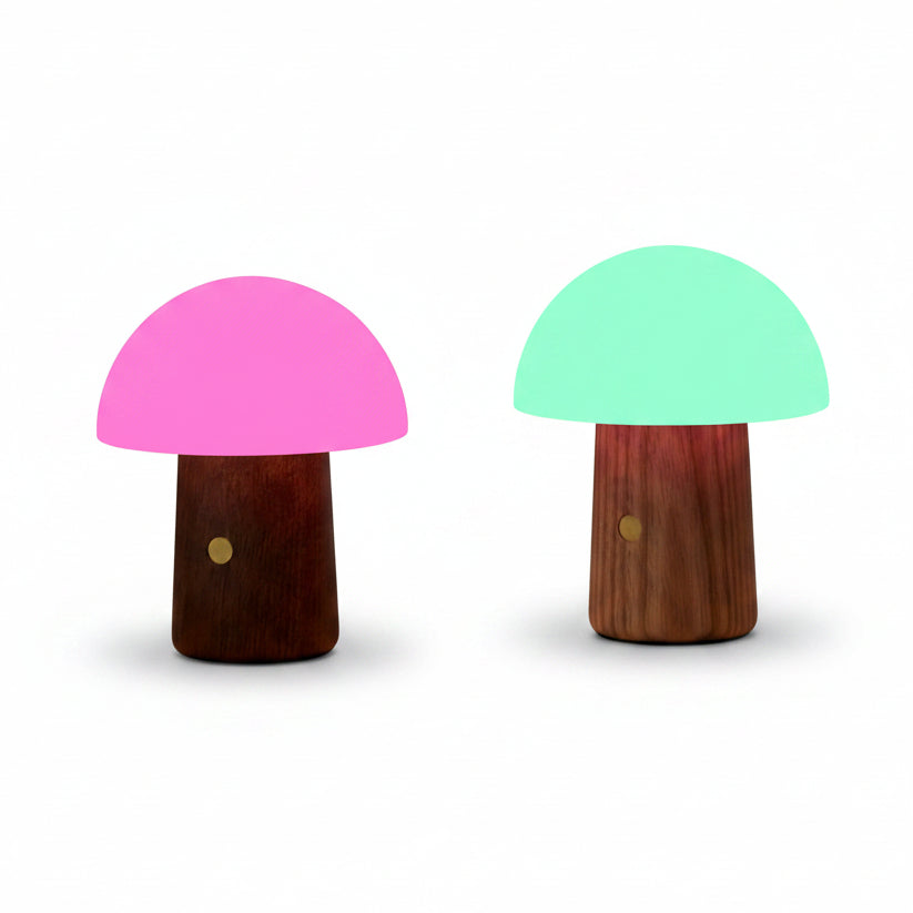Alice mushroom lamps glowing pink and green on a bamboo bath tray