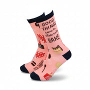 Pink women’s bamboo socks with baking illustrations and the phrase “Good things come to those who bake” in bold lettering.
