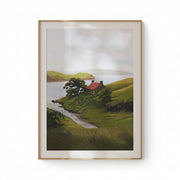 Framed painting of a landscape with a house by a lake on a beige wall.
