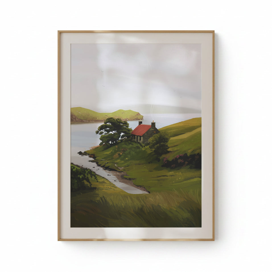 Framed painting of a landscape with a house by a lake on a beige wall.