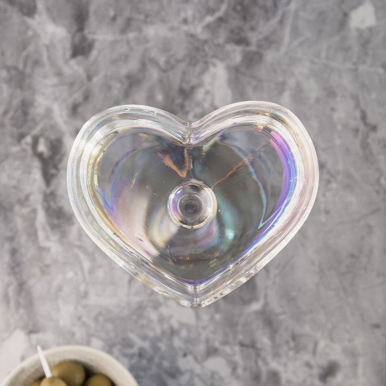 Heart-shaped iridescent coupes, side view
