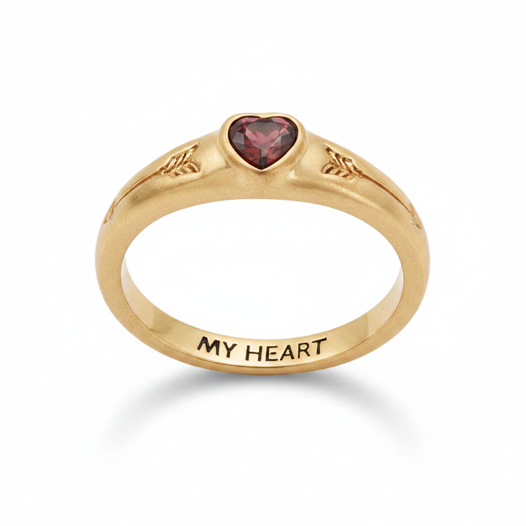 Angled view of the ring showing the red heart stone and My Heart engraving.