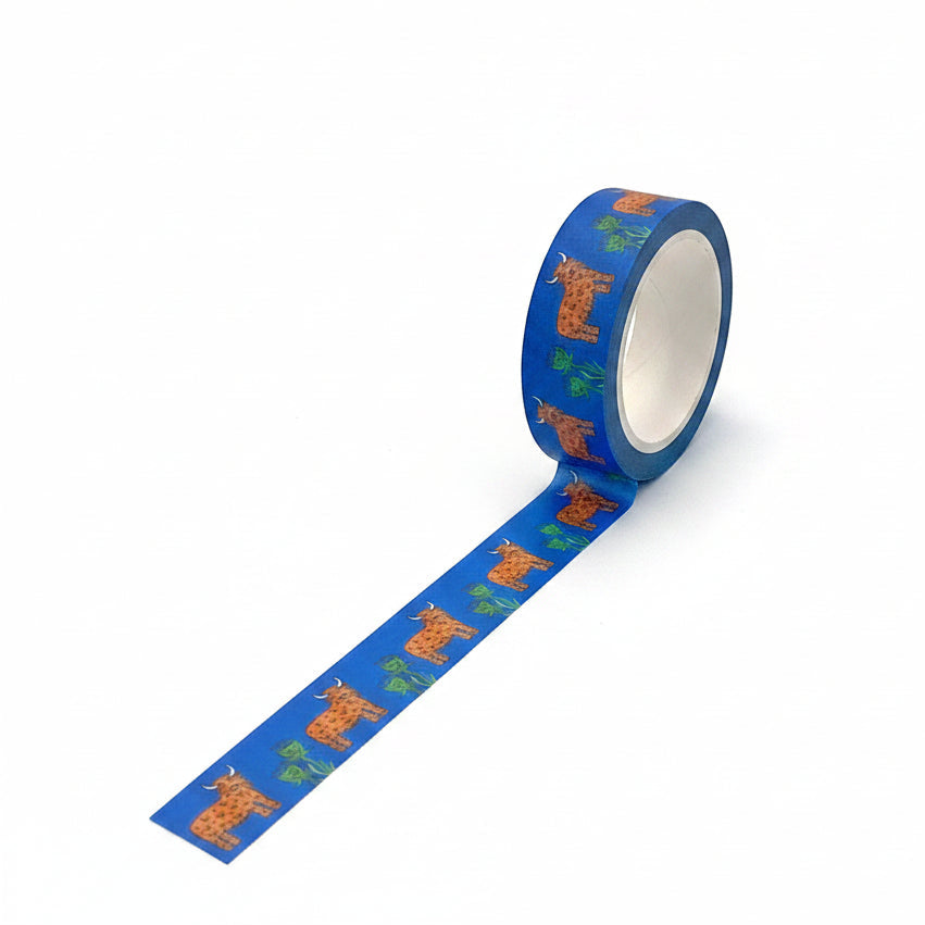 Roll of blue tape with cow pattern on a white background