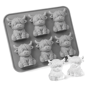 Grey silicone mould with six Highland cow cavities beside two clear cow-shaped ice cubes