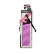 Pink reading aid bookmark and its packaging shown on an open book