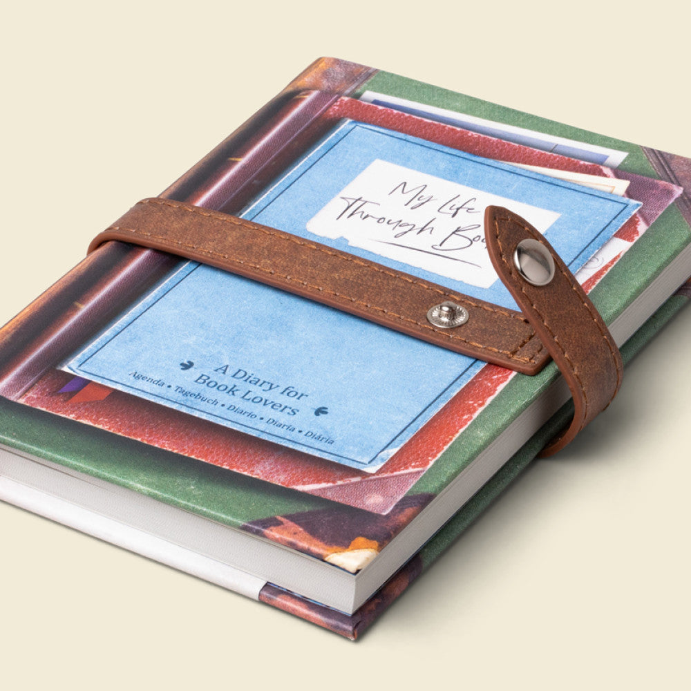 Close up of the leather-look strap and press stud on the journal