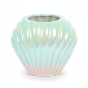 Pearlescent shell shaped vase showing blue pink iridescent finish