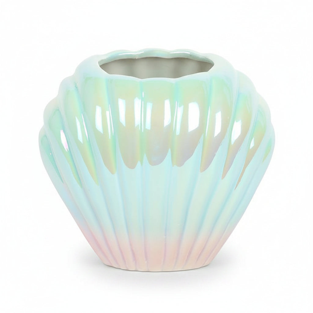 Pearlescent shell shaped vase showing blue pink iridescent finish